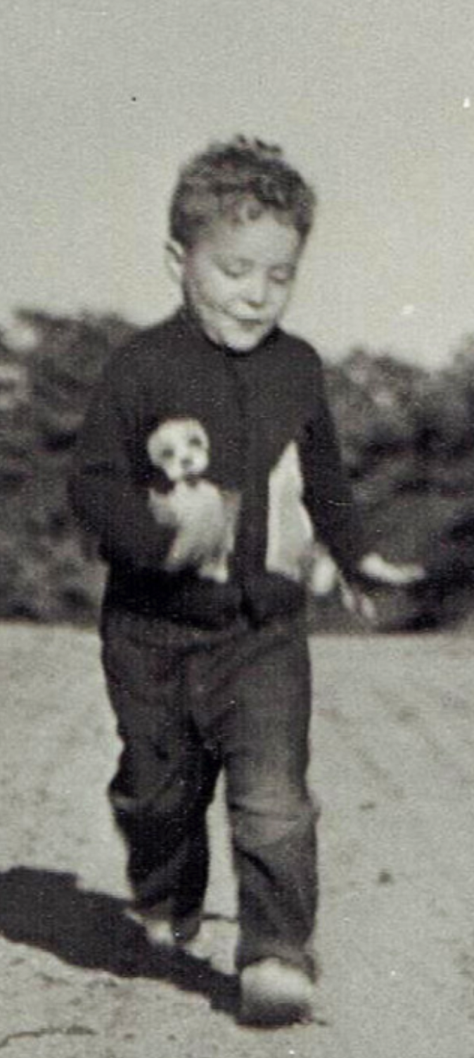 Close view of Steven Forrest as a small child walking along a dirt road on Cape Cod